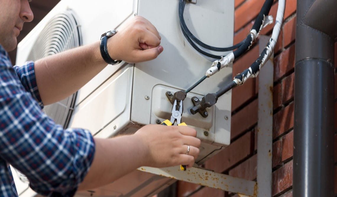 repairing outdoor air conditioner unit